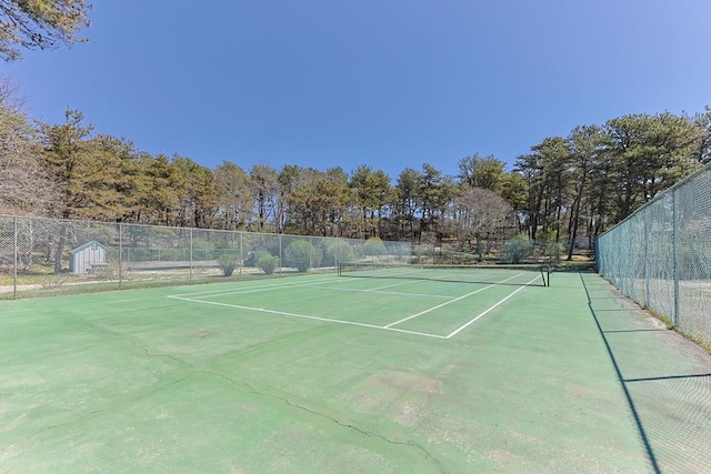 view of sport court with fence