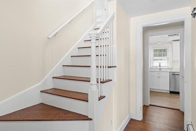 23 Lenox Cir, Lawrence, MA 01843 - stairs featuring a baseboard heating unit and wood finished floors