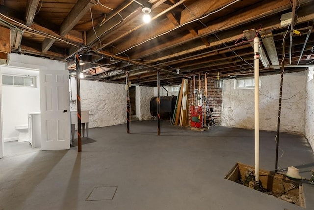 23 Lenox Cir, Lawrence, MA 01843 - basement with oil tank and a heating unit