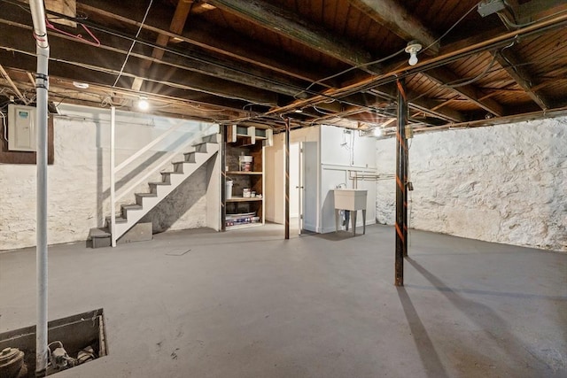 23 Lenox Cir, Lawrence, MA 01843 - unfinished basement featuring stairway and a sink