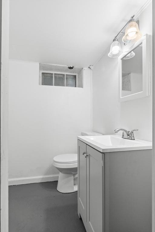 23 Lenox Cir, Lawrence, MA 01843 - bathroom featuring vanity, toilet, concrete floors, and baseboards