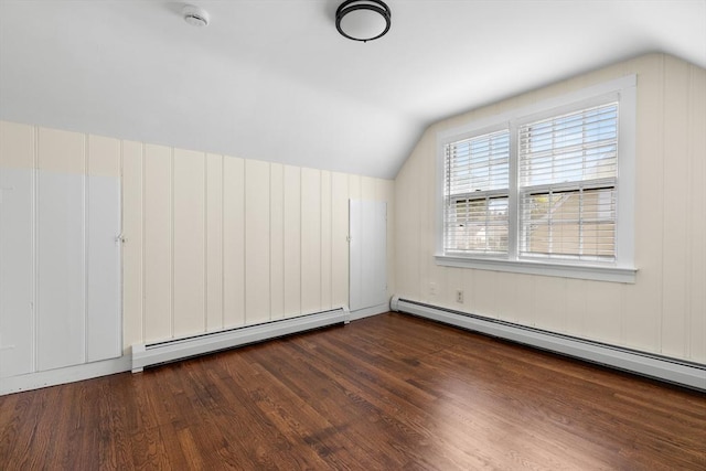 23 Lenox Cir, Lawrence, MA 01843 - additional living space with a baseboard radiator, vaulted ceiling, and wood finished floors