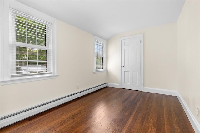 23 Lenox Cir, Lawrence, MA 01843 - unfurnished bedroom with a baseboard radiator, dark wood finished floors, multiple windows, and baseboards