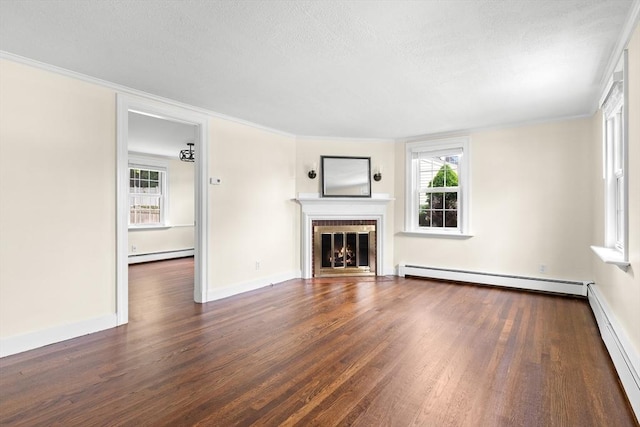23 Lenox Cir, Lawrence, MA 01843 - unfurnished living room with a baseboard radiator, a baseboard heating unit, wood finished floors, a brick fireplace, and a textured ceiling