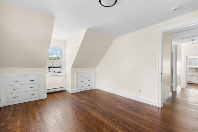 23 Lenox Cir, Lawrence, MA 01843 - additional living space featuring a baseboard heating unit, wood finished floors, baseboards, attic access, and vaulted ceiling