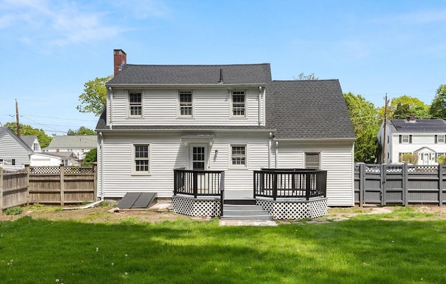 23 Lenox Cir, Lawrence, MA 01843 - back of house with a wooden deck, a chimney, and roof with shingles