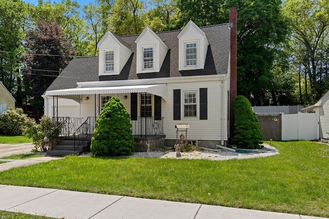 23 Lenox Cir, Lawrence, MA 01843 - cape cod house featuring a chimney, covered porch, and roof with shingles