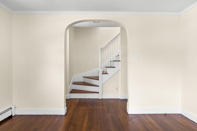 23 Lenox Cir, Lawrence, MA 01843 - staircase with a baseboard heating unit, wood finished floors, baseboards, arched walkways, and crown molding