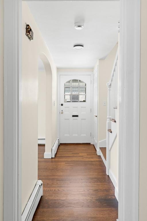 23 Lenox Cir, Lawrence, MA 01843 - hall featuring a baseboard heating unit, a baseboard radiator, arched walkways, and dark wood-style flooring