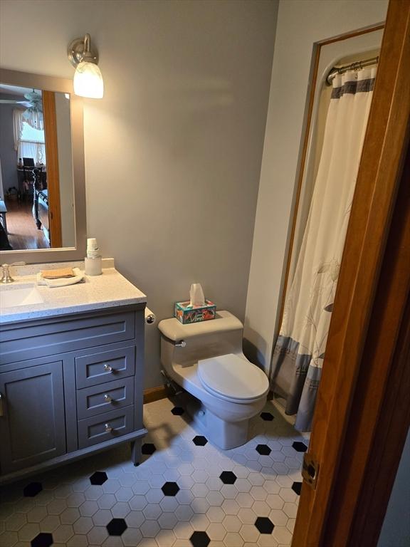 127 Parker Ln, Ludlow, MA 01056 - bathroom with toilet, tile patterned flooring, vanity, and curtained shower