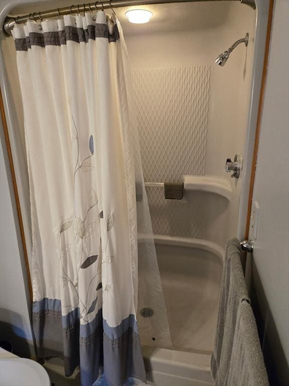 127 Parker Ln, Ludlow, MA 01056 - bathroom featuring a shower with curtain and toilet
