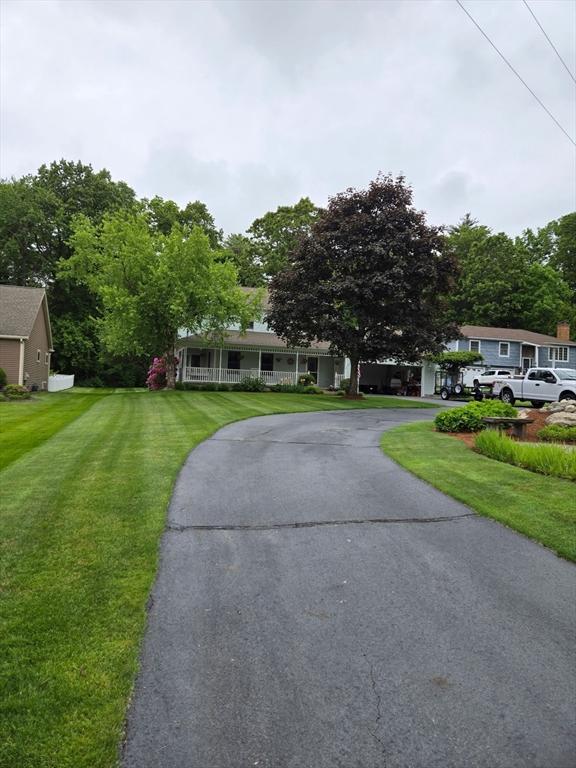 127 Parker Ln, Ludlow, MA 01056 - view of front facade featuring a front yard and asphalt driveway