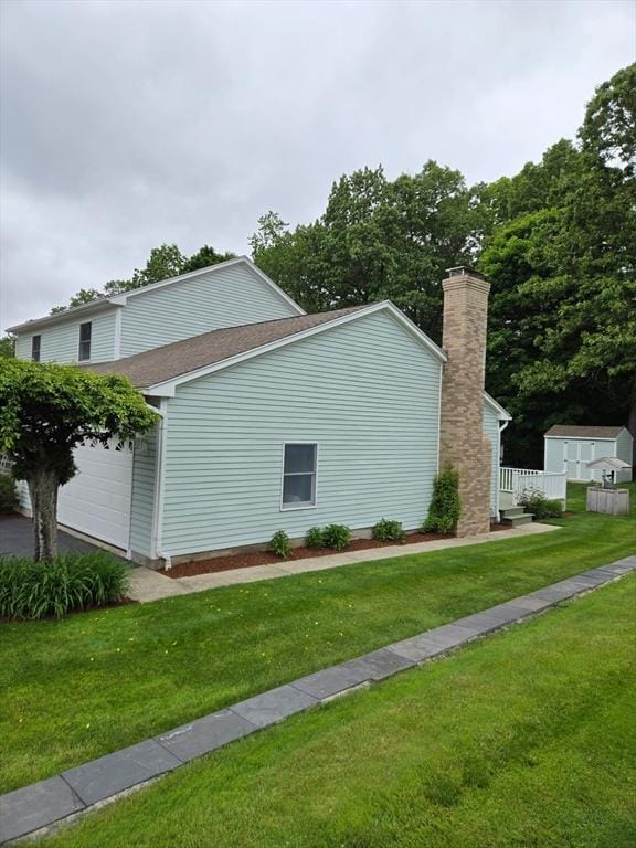 127 Parker Ln, Ludlow, MA 01056 - view of home's exterior with a yard and a garage