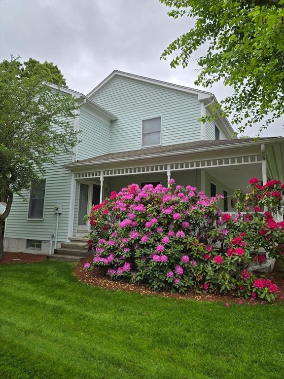 127 Parker Ln, Ludlow, MA 01056 - back of house featuring a yard and covered porch