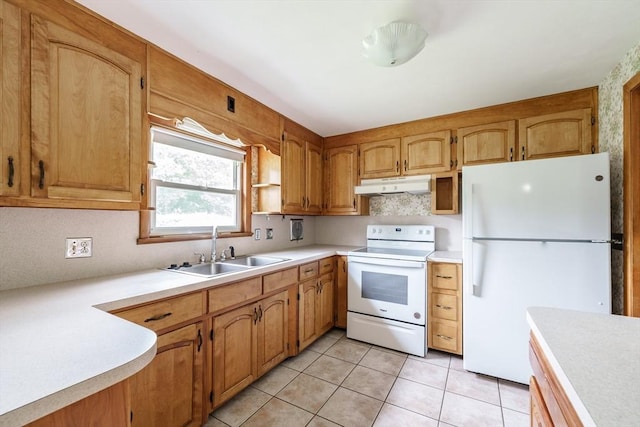 46 Birchland Ave, Springfield, MA 01119 - kitchen featuring white appliances, under cabinet range hood, light countertops, light tile patterned floors, and brown cabinetry