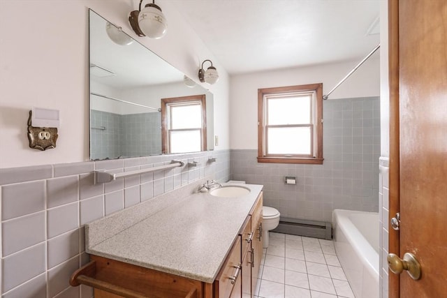 46 Birchland Ave, Springfield, MA 01119 - bathroom with tile walls, a baseboard heating unit, vanity, a shower, and a tub