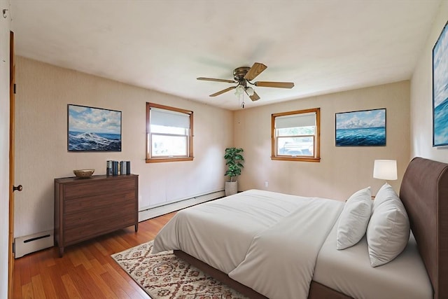 46 Birchland Ave, Springfield, MA 01119 - bedroom with a baseboard radiator, multiple windows, and wood finished floors