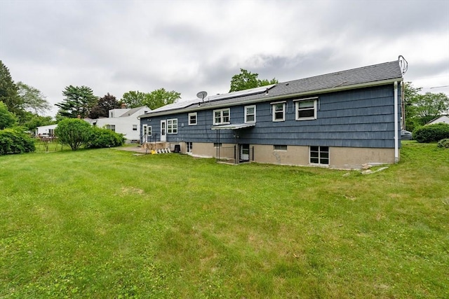 46 Birchland Ave, Springfield, MA 01119 - back of property with a yard and solar panels