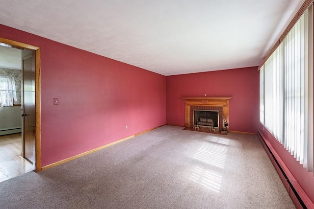 46 Birchland Ave, Springfield, MA 01119 - unfurnished living room with plenty of natural light, carpet, a baseboard radiator, and a fireplace with flush hearth