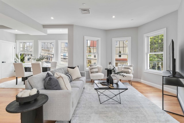 living room with light hardwood / wood-style floors