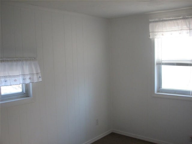 436 Brown St, Attleboro, MA 02703 - empty room with healthy amount of natural light and wood walls
