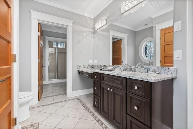 bathroom with tile patterned floors, toilet, a shower with door, vanity, and ornamental molding