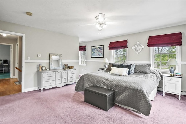bedroom featuring ceiling fan, carpet, and baseboards
