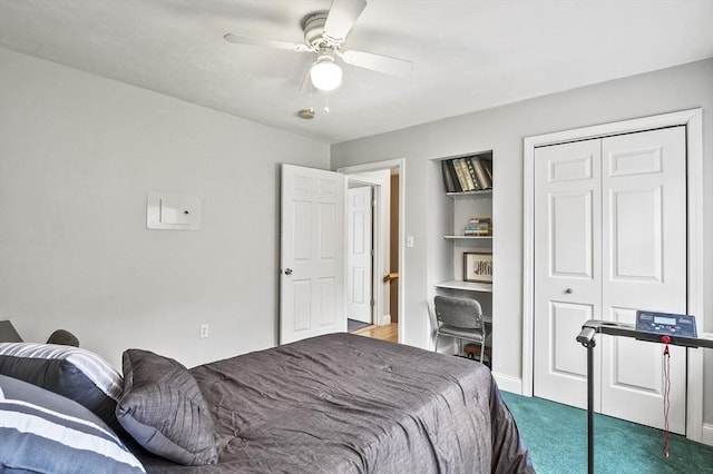 carpeted bedroom with ceiling fan and a closet