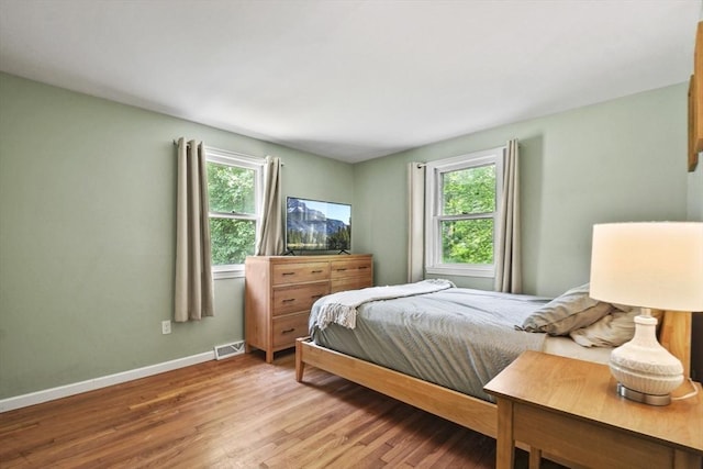 180 Slab Bridge Rd, Freetown, MA 02702 - bedroom featuring multiple windows and light wood finished floors