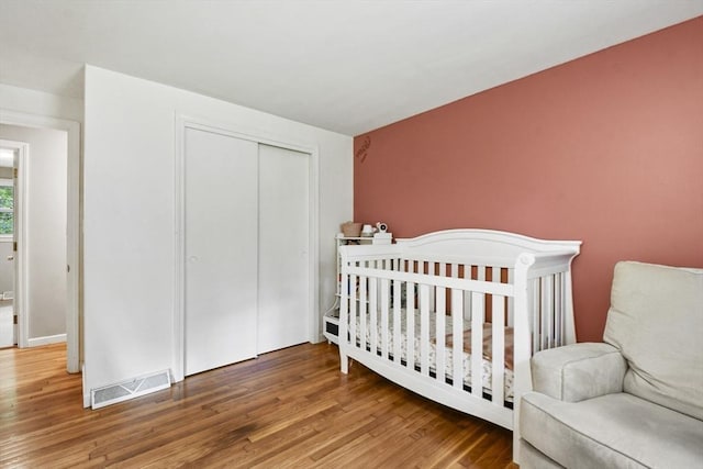 180 Slab Bridge Rd, Freetown, MA 02702 - bedroom featuring wood finished floors and a closet