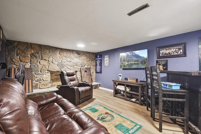 180 Slab Bridge Rd, Freetown, MA 02702 - living room featuring wood finished floors and a stone fireplace