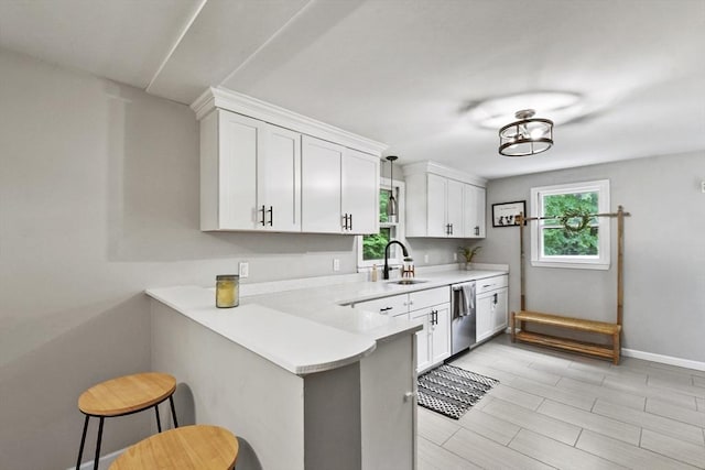 180 Slab Bridge Rd, Freetown, MA 02702 - kitchen with a breakfast bar area, light countertops, white cabinets, and dishwasher