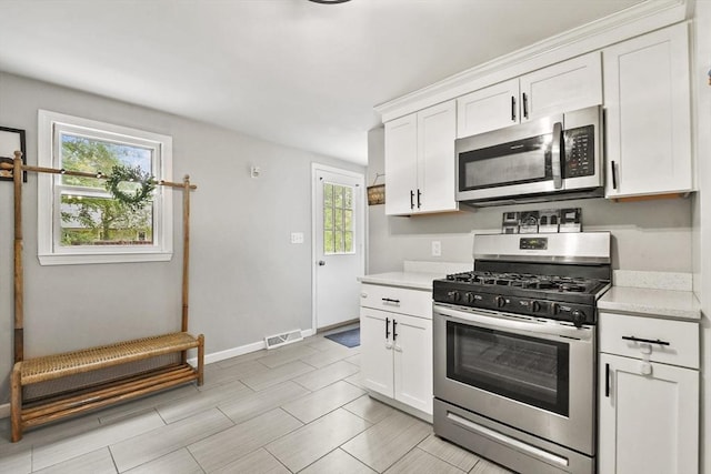 180 Slab Bridge Rd, Freetown, MA 02702 - kitchen with appliances with stainless steel finishes, light countertops, and plenty of natural light