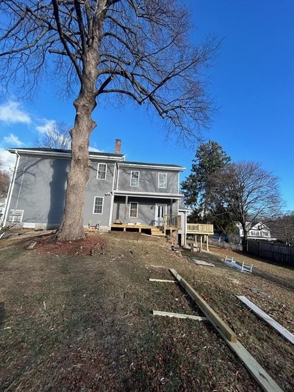 rear view of house with a wooden deck