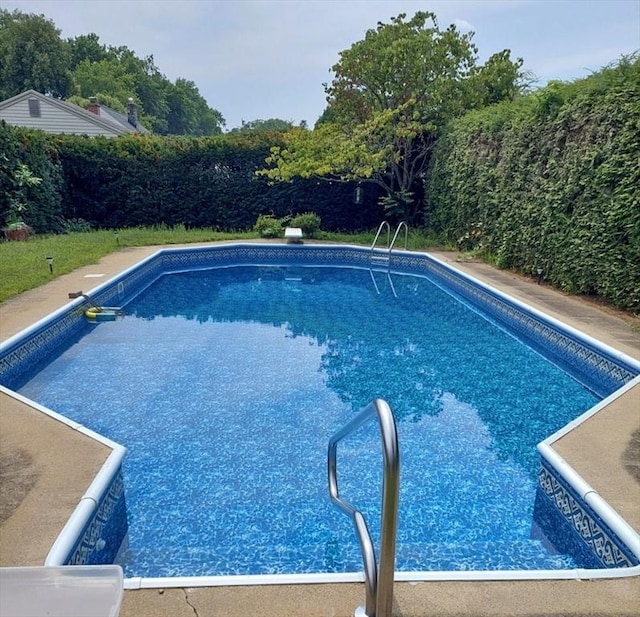 view of pool with a fenced in pool