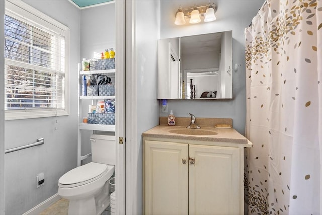 bathroom featuring vanity and toilet