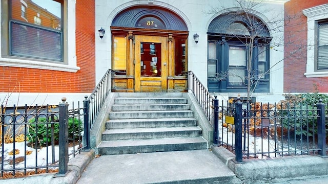 87 Gainsborough St Unit 202, Boston, MA 02115 - doorway to property featuring brick siding and a porch