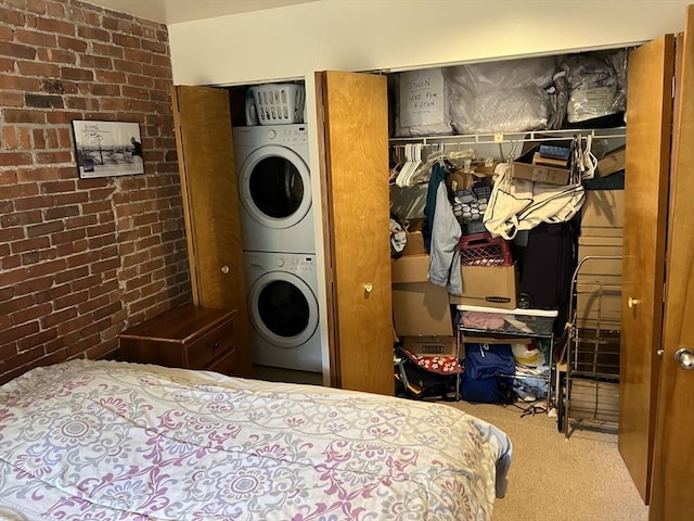 87 Gainsborough St Unit 202, Boston, MA 02115 - carpeted bedroom featuring stacked washer and clothes dryer and brick wall