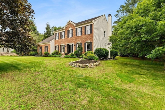 3 Norumbega Cir, Franklin, MA 02038 - colonial house with a front lawn, a chimney, and brick siding