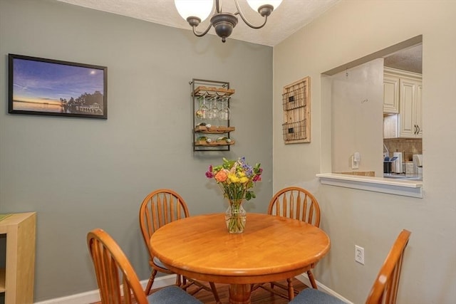 280 Elm St Unit 26, Marlborough, MA 01752 - dining room featuring a chandelier and baseboards
