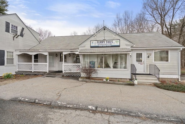160 Shrewsbury St, Holden, MA 01520 - view of front facade with a porch, driveway, and roof with shingles