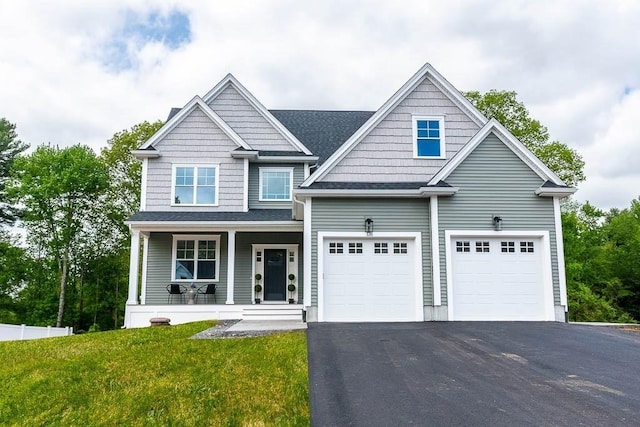 131 Colts Way, Attleboro, MA 02703 - view of front facade with asphalt driveway, a porch, a front lawn, and an attached garage