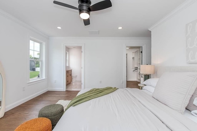 131 Colts Way, Attleboro, MA 02703 - bedroom with ornamental molding, baseboards, wood finished floors, a walk in closet, and ensuite bathroom