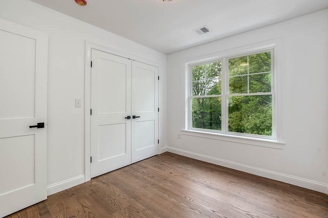 131 Colts Way, Attleboro, MA 02703 - unfurnished bedroom with baseboards, wood finished floors, and a closet