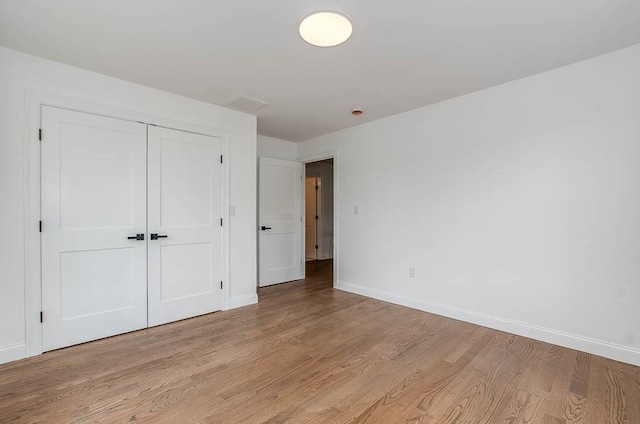 131 Colts Way, Attleboro, MA 02703 - unfurnished bedroom with light wood-style flooring, baseboards, and a closet