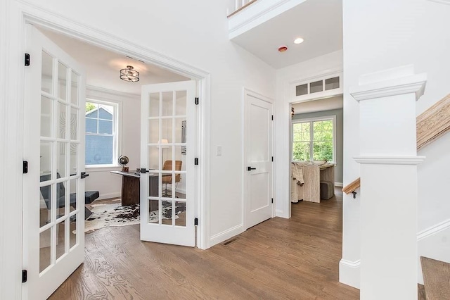 131 Colts Way, Attleboro, MA 02703 - hall with french doors, wood finished floors, and baseboards