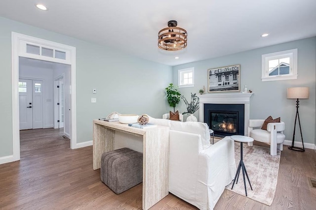 131 Colts Way, Attleboro, MA 02703 - living area featuring a glass covered fireplace, light wood-style flooring, baseboards, and recessed lighting