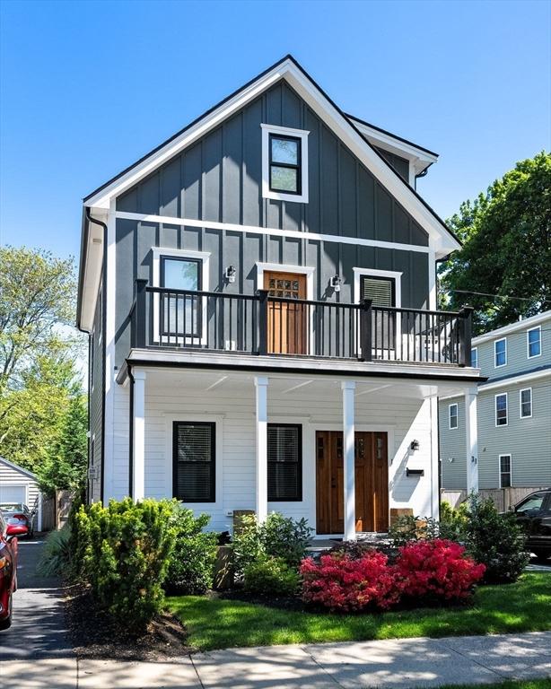 31 Henderson St Unit 1, Arlington, MA 02474 - view of front of property featuring a balcony, board and batten siding, and a porch