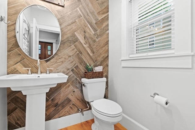 31 Henderson St Unit 1, Arlington, MA 02474 - half bathroom featuring toilet, plenty of natural light, and baseboards
