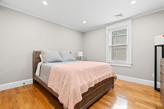 31 Henderson St Unit 1, Arlington, MA 02474 - bedroom featuring baseboards, recessed lighting, light wood-style floors, and ornamental molding